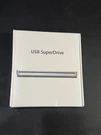 Apple Usb Super Drive MD564LL/A White Sealed Box Read. Fixed Price $90.00.